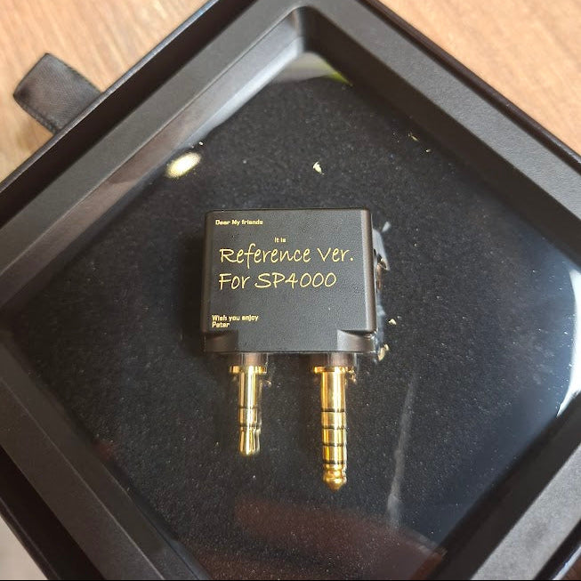 Electronic component in a black case on a wooden surface